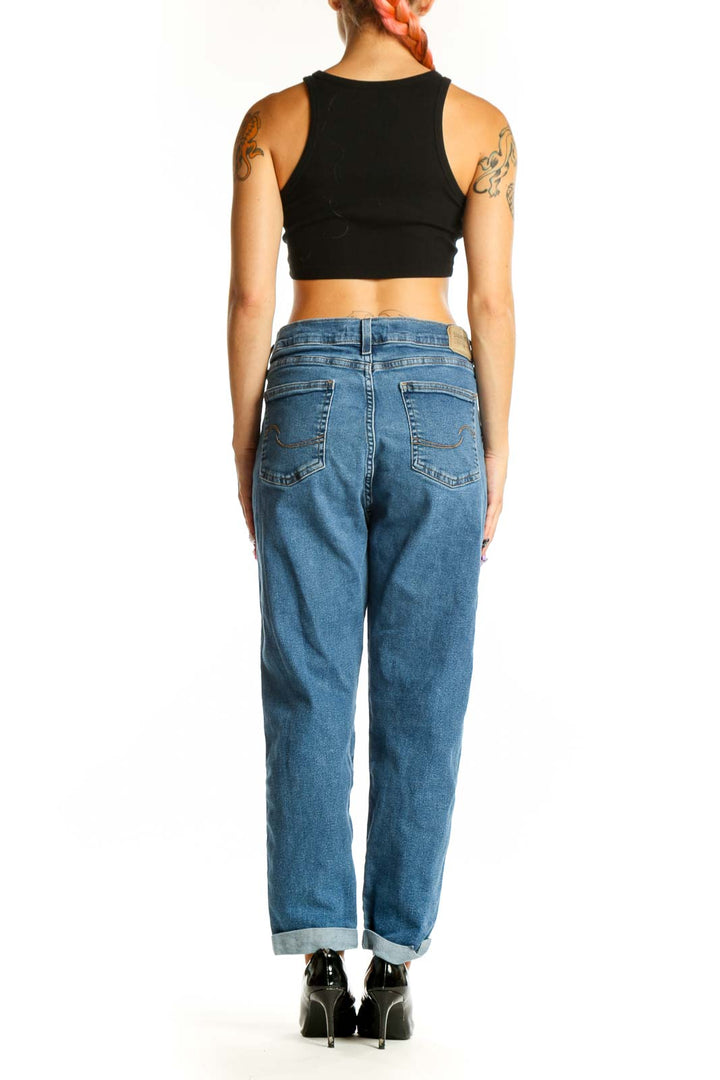 Side view of woman wearing Levi's classic straight leg jeans with black top