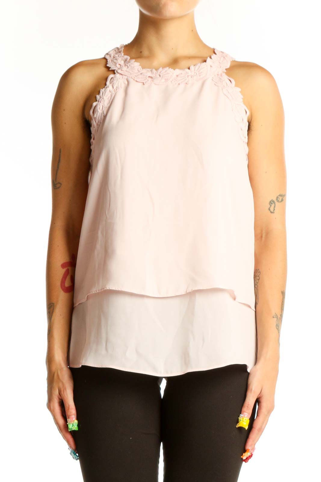 Front view of light pink layered sleeveless blouse with ruffle neckline