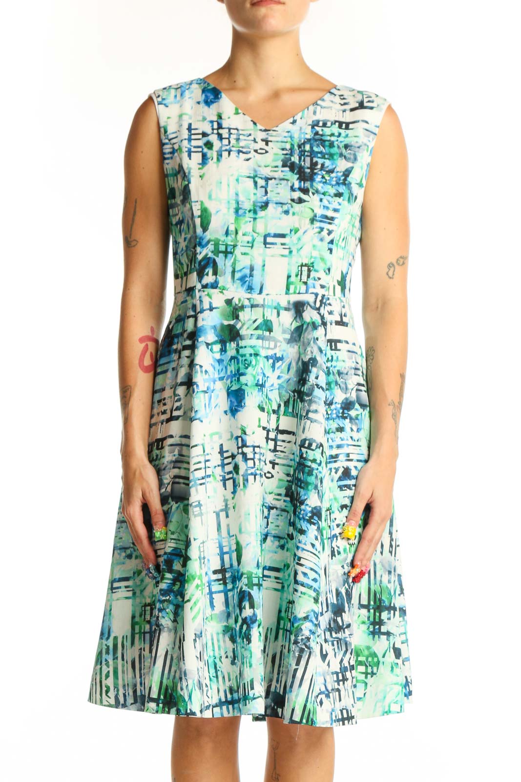 Front view of Shesmiss blue and green abstract print sleeveless dress