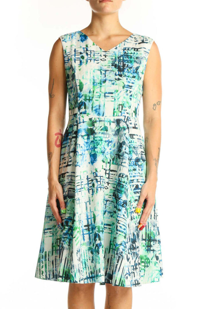 Front view of Shesmiss blue and green abstract print sleeveless dress