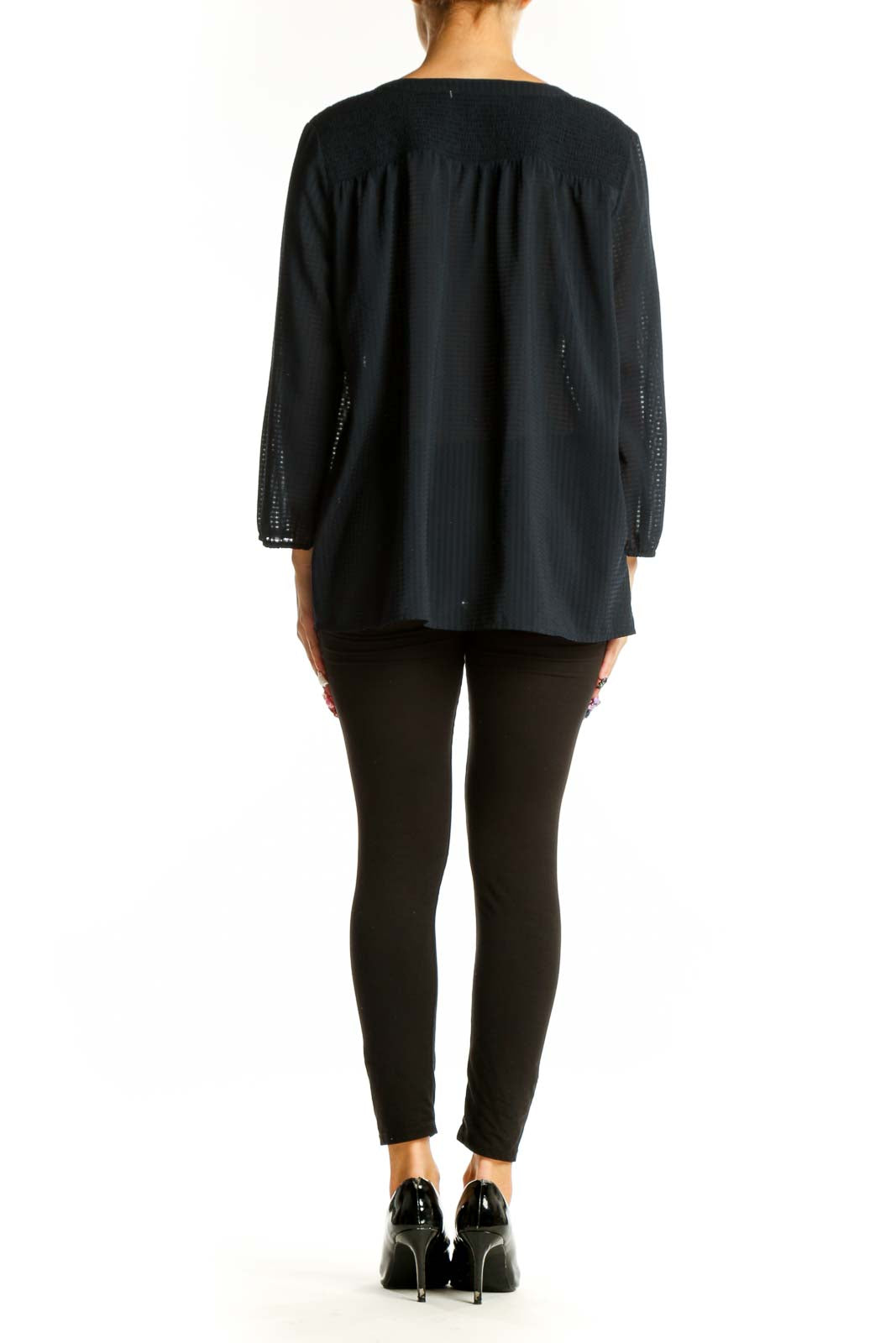 Side view of Ann Taylor black sheer V-neck blouse showing relaxed fit