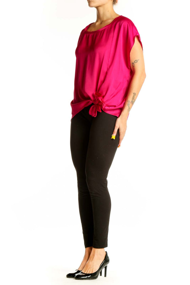 Front view of hot pink DKNY blouse with side-tie detail