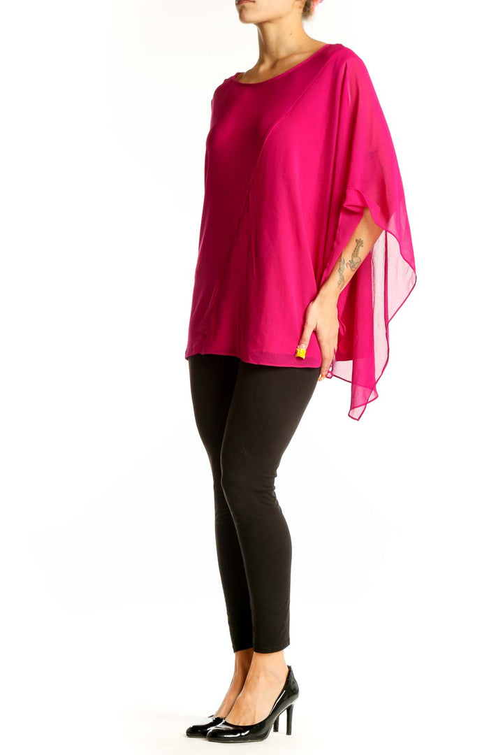 Front view of hot pink asymmetrical DKNY blouse