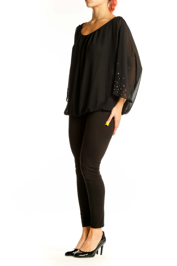 Front view of black SilkRoll blouse with rhinestone-embellished batwing sleeves