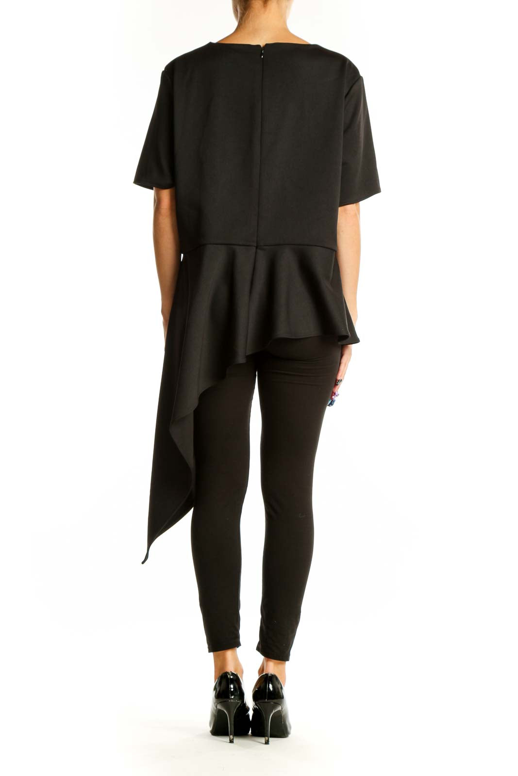Side view of Vince Camuto black asymmetric layered polyester top on model