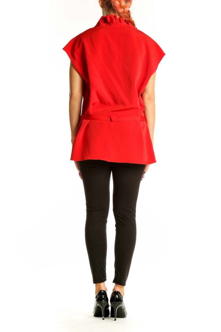Side view of red Elie Tahari sleeveless blouse showing drape and fit