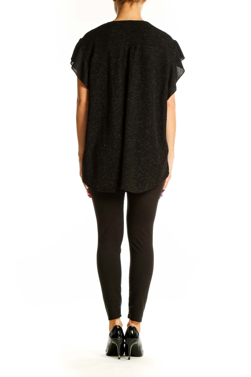 Side view of Vince Camuto black sparkly top showing flutter sleeves and length