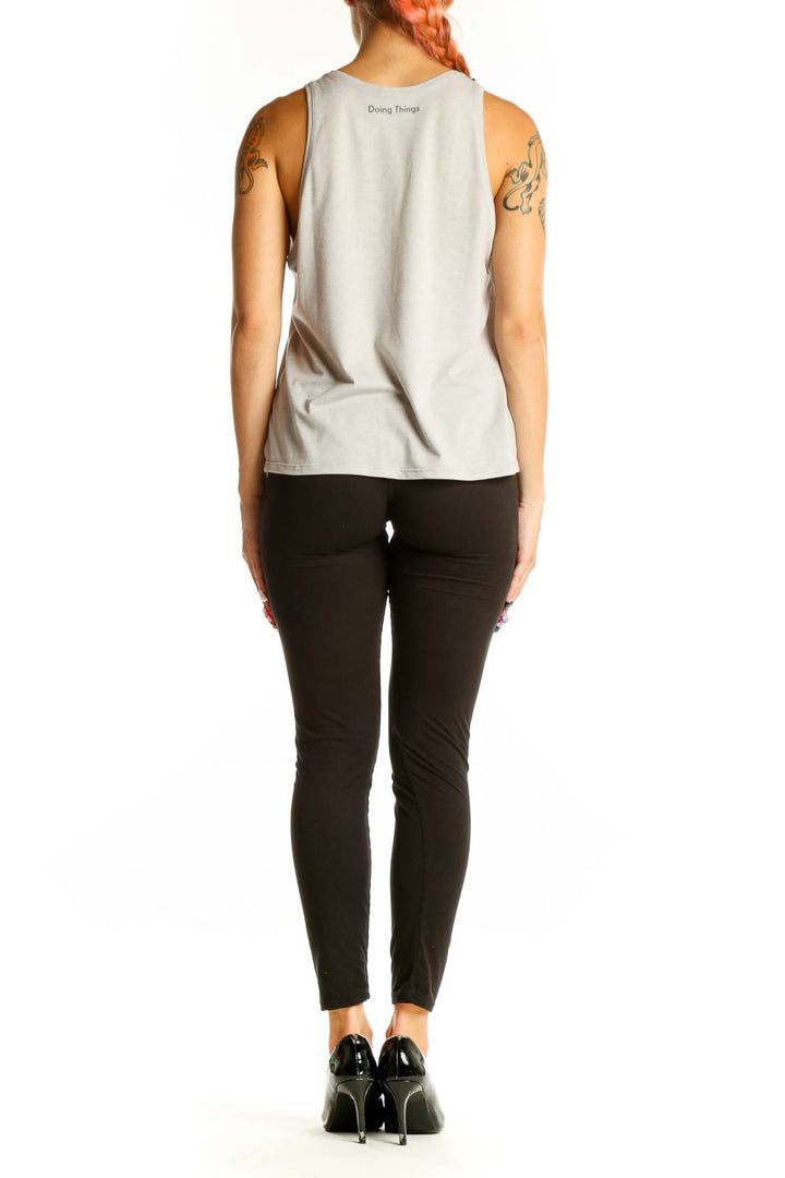 Side view of light gray cotton tank top from Outdoor Voices on model