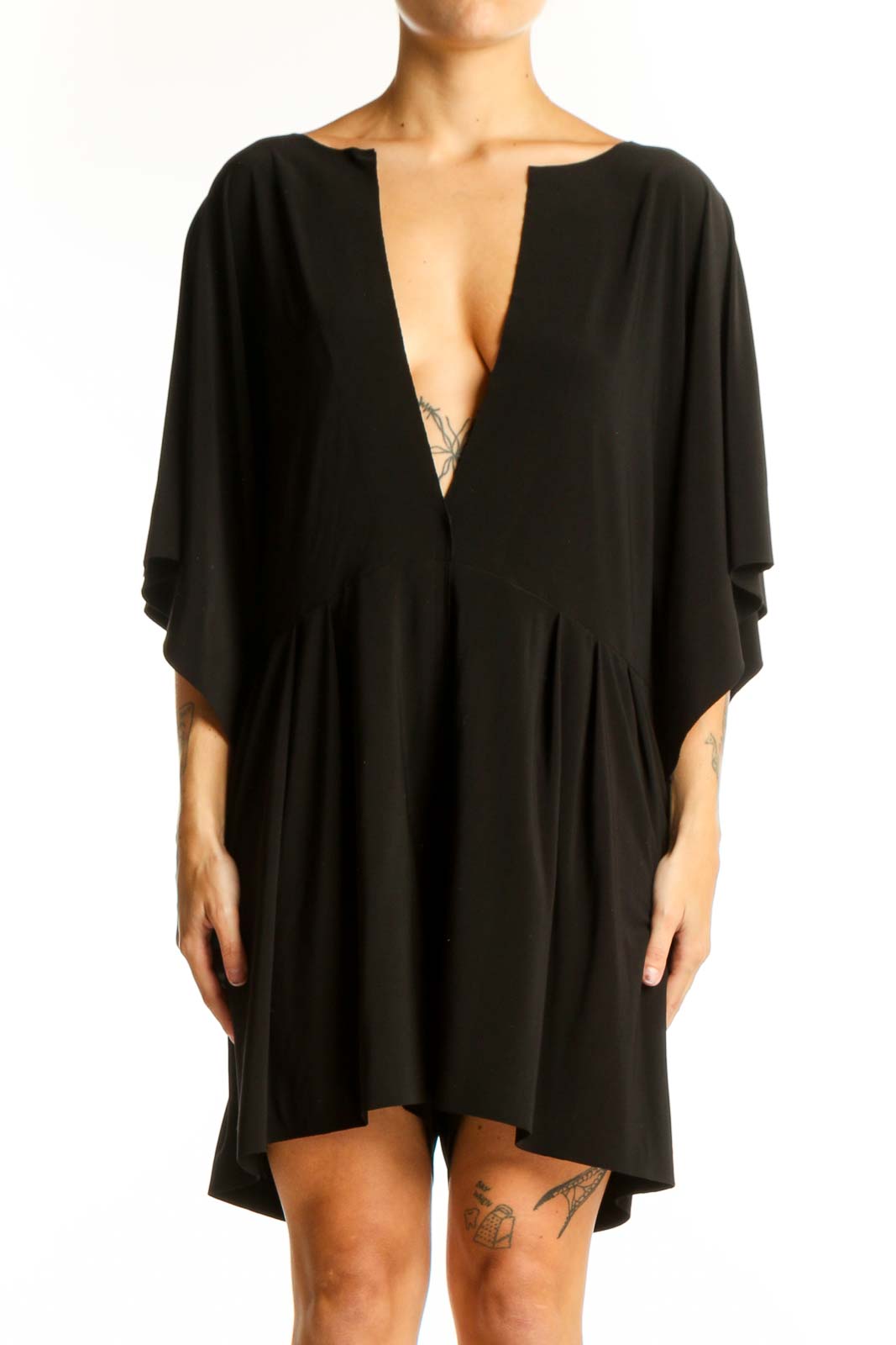 Front view of black NORMA KAMALI mini dress with plunging V-neck