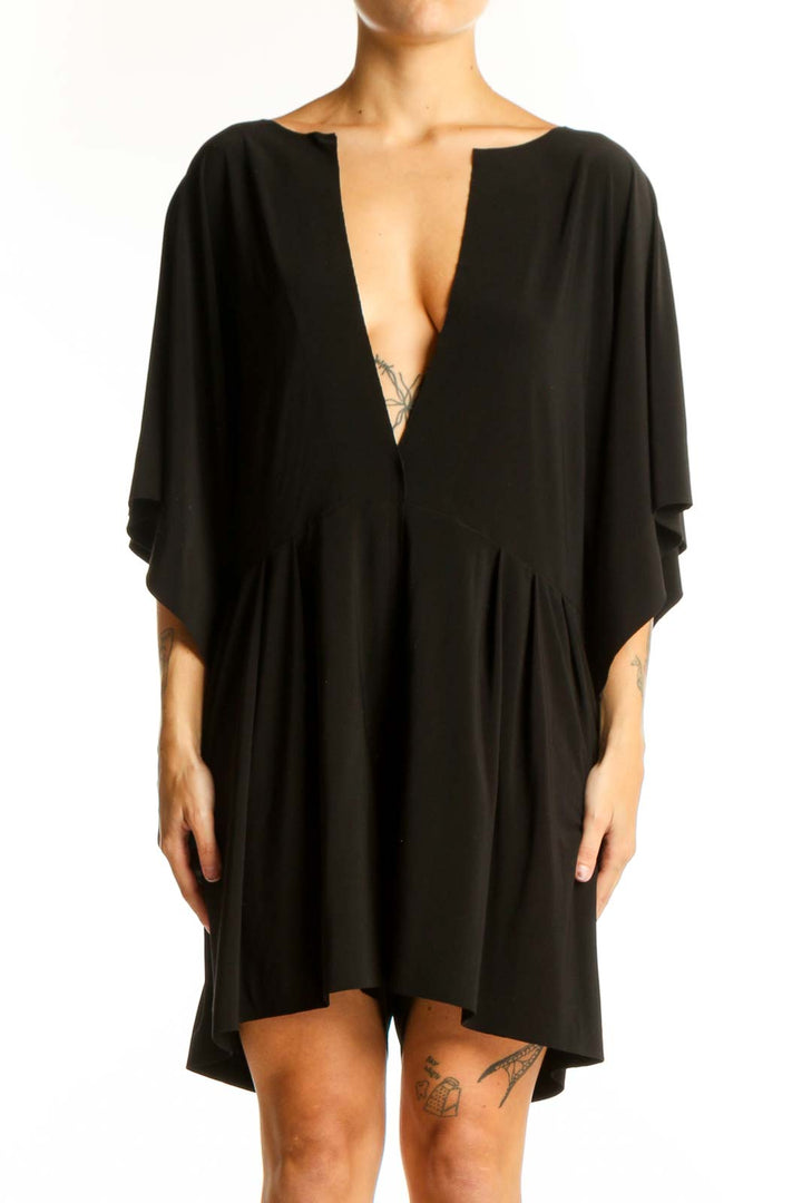 Front view of black NORMA KAMALI mini dress with plunging V-neck