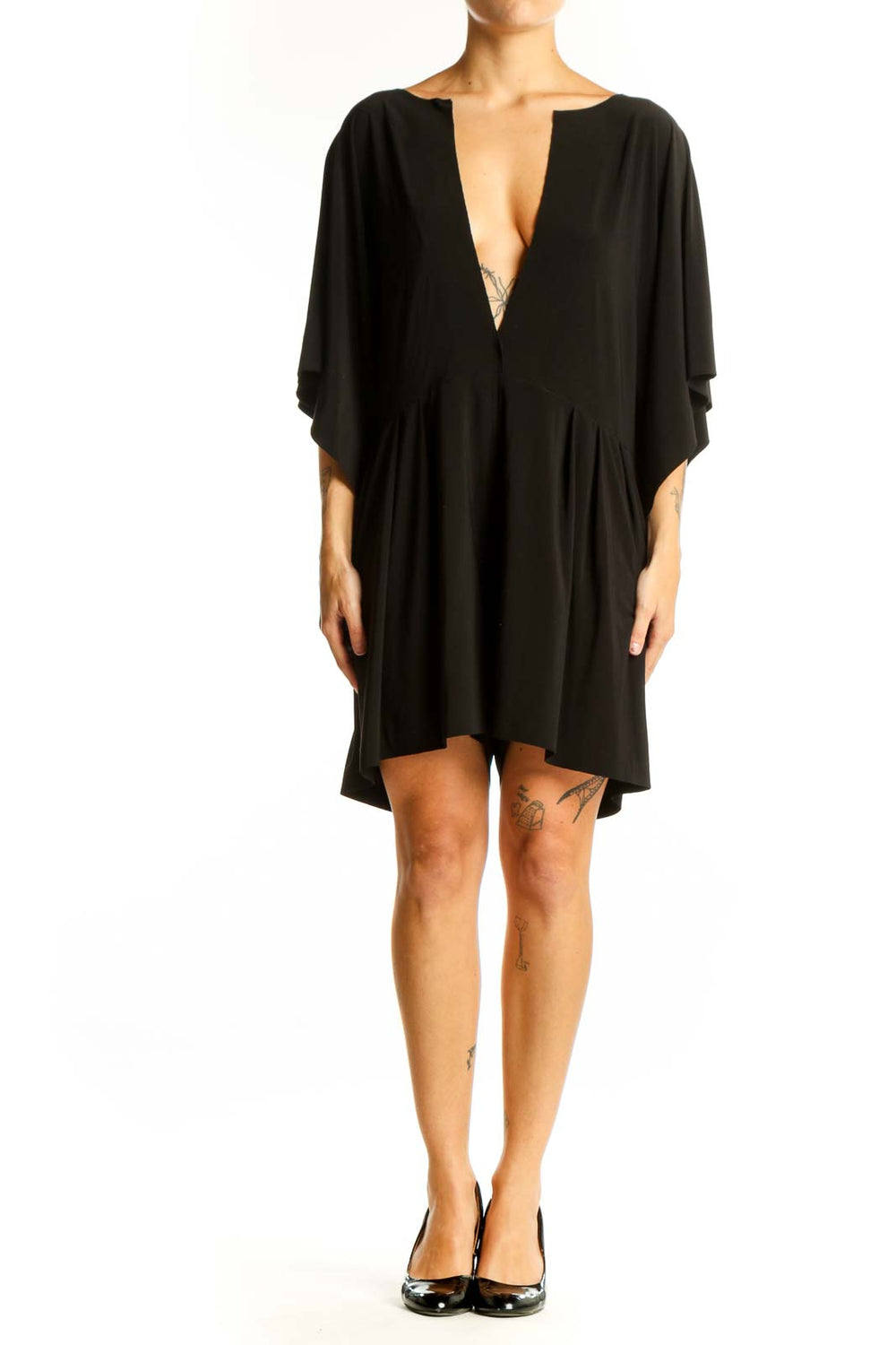 Front view of black NORMA KAMALI mini dress with plunging V-neck