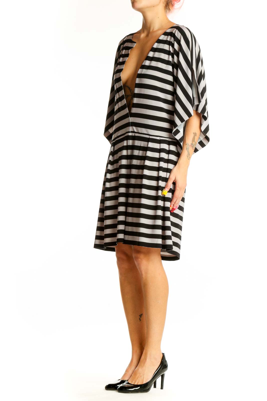 Front view of NORMA KAMALI Black and White Striped Plunge Neck Dress with deep V-neckline
