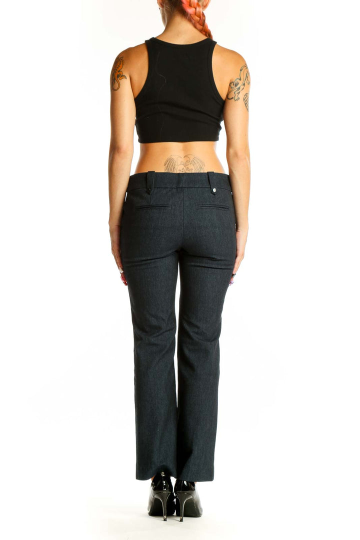 Side view of LOFT charcoal gray straight-leg trousers on model with black crop top