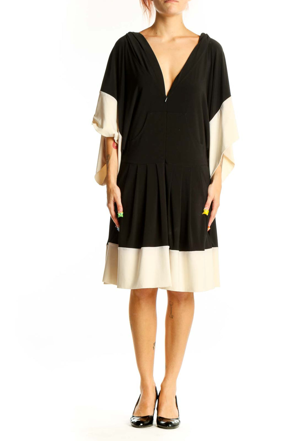 Front view of NORMA KAMALI black and cream color-block dress with V-neck and batwing sleeves
