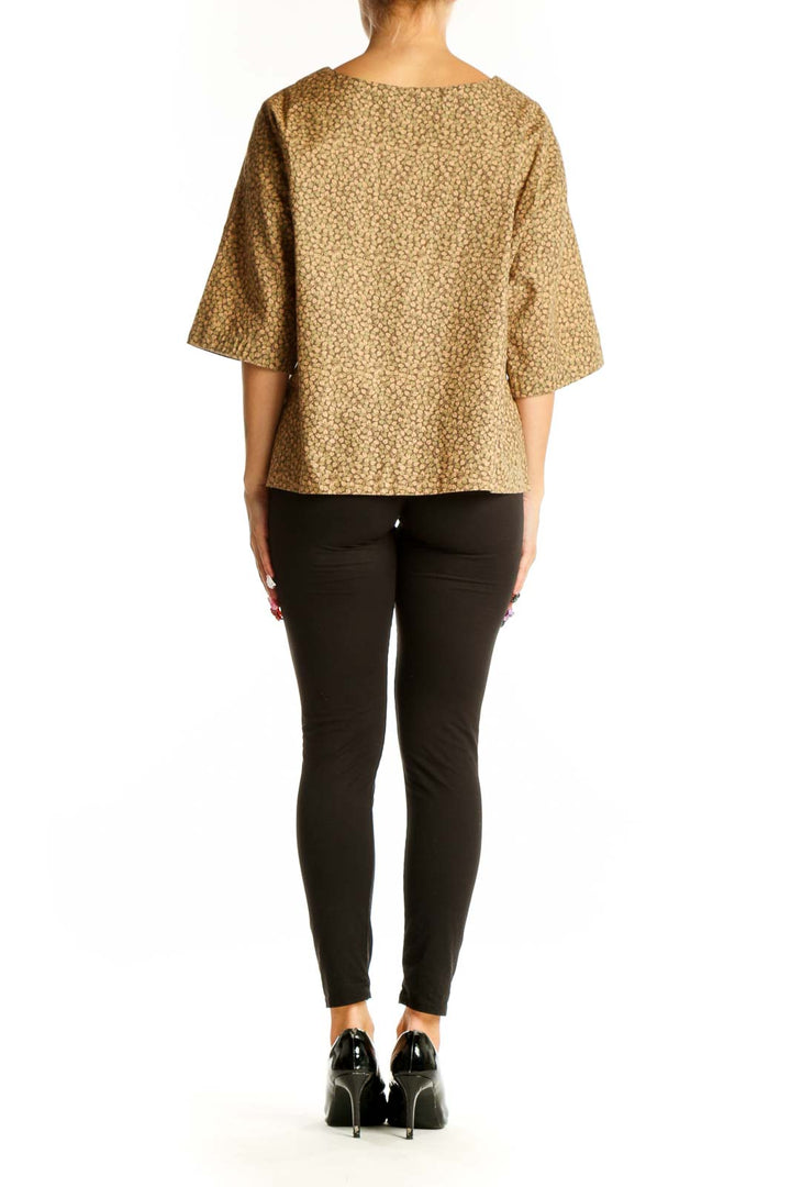 Back view of tan floral print oversized blouse by SilkRoll