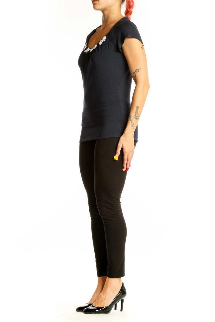 Front view of LOFT black cotton top with embellished neckline