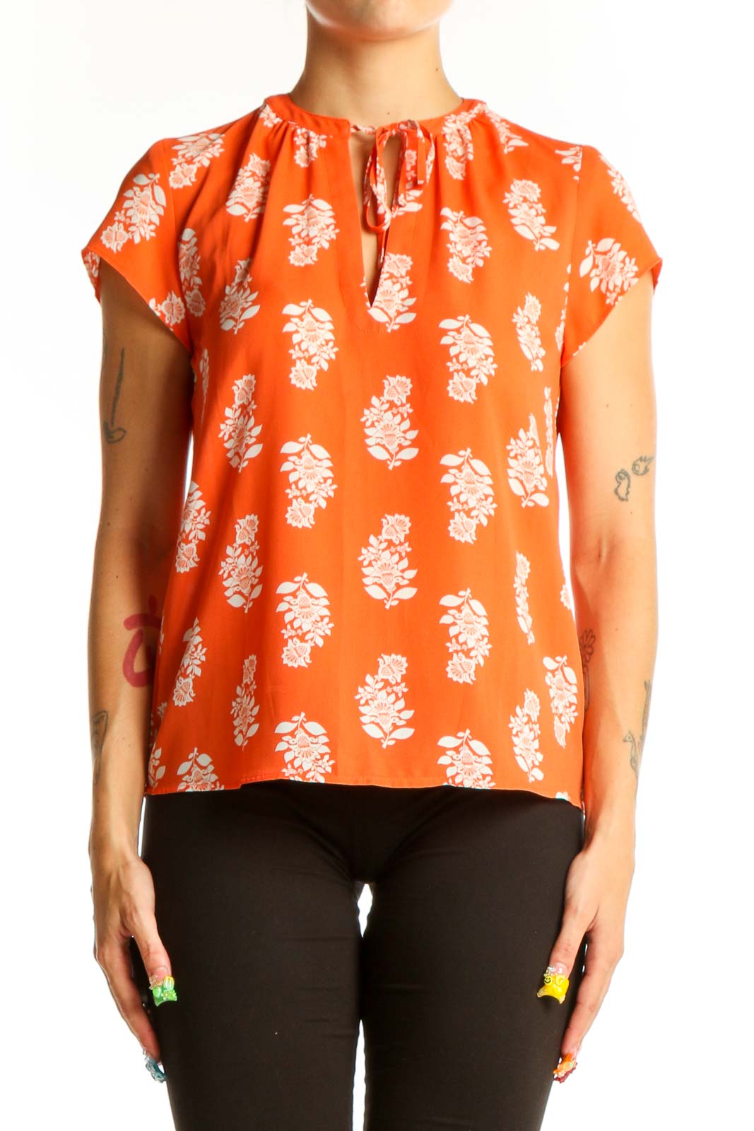 Front view of orange Ann Taylor blouse with white floral print and tie neckline