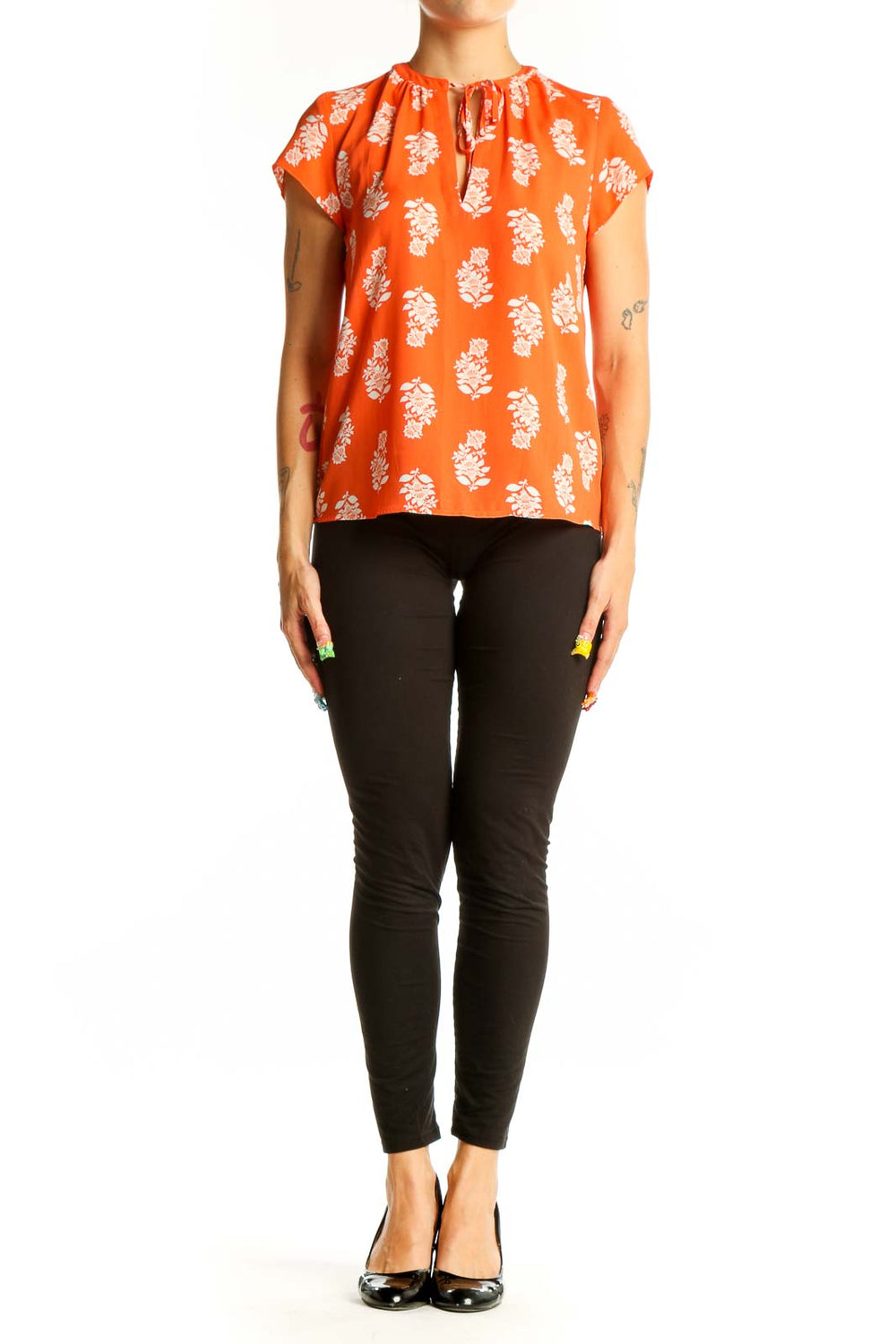 Front view of orange Ann Taylor blouse with white floral print and tie neckline