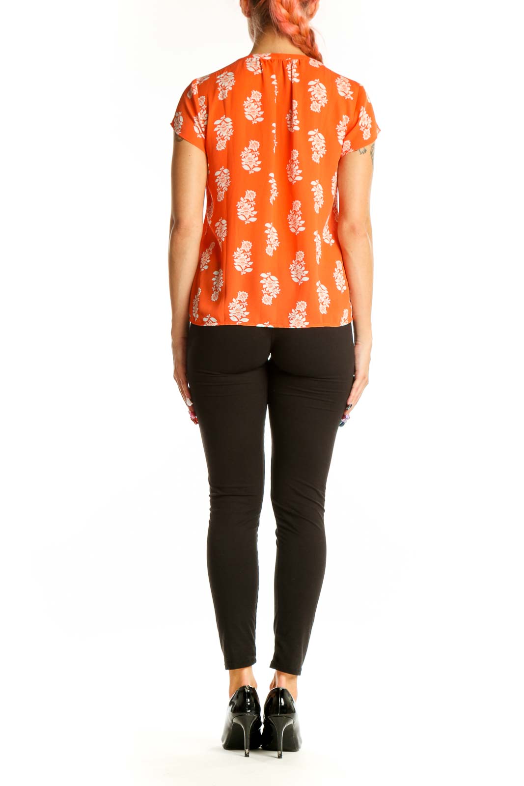 Side view of orange Ann Taylor blouse showing short sleeves and floral pattern