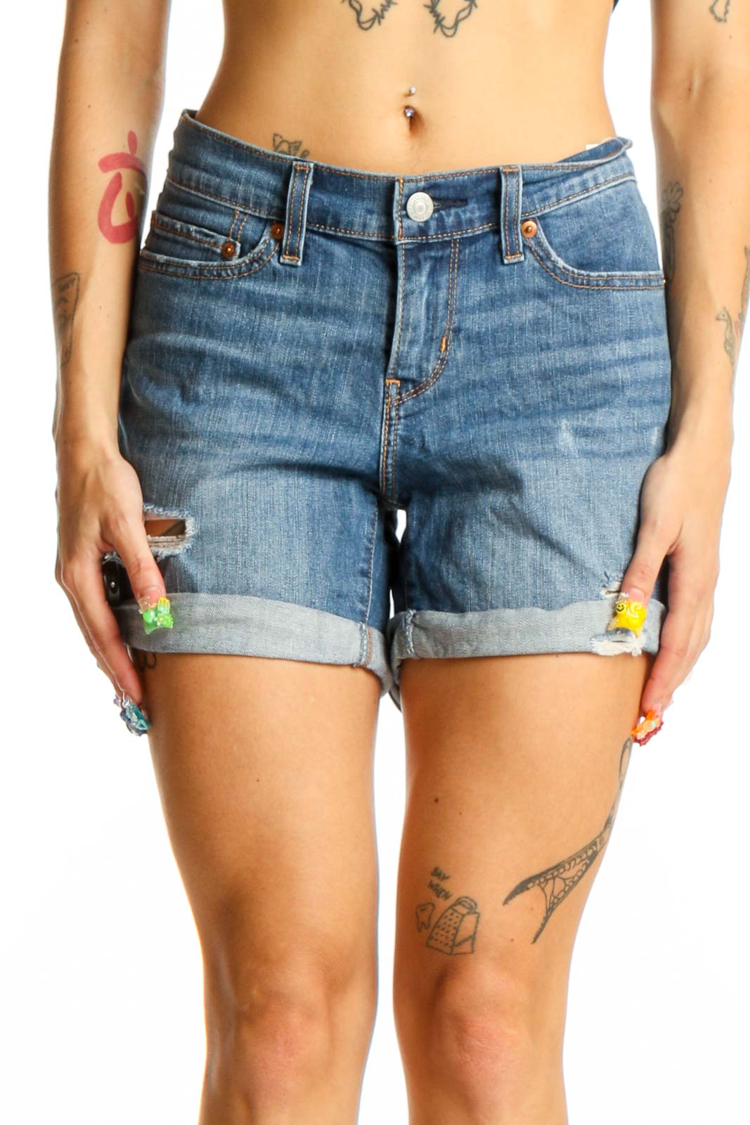 Front view of blue distressed Levi's denim shorts with rolled cuffs