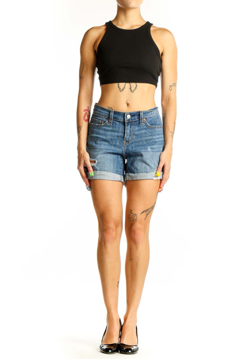 Front view of blue distressed Levi's denim shorts with rolled cuffs