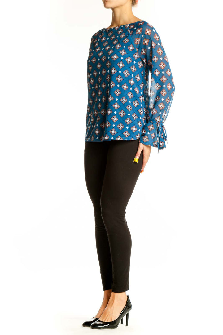 Front view of 41 Hawthorn blue floral print long sleeve blouse with boat neckline
