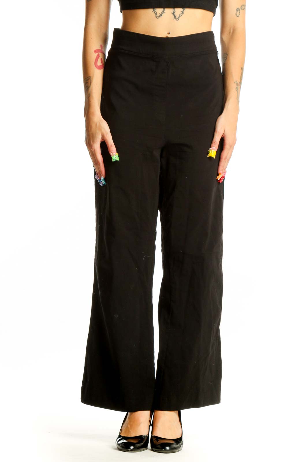 Front view of Calvin Klein black wide-leg trousers on model