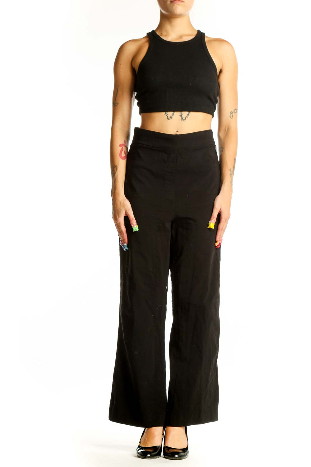 Front view of Calvin Klein black wide-leg trousers on model