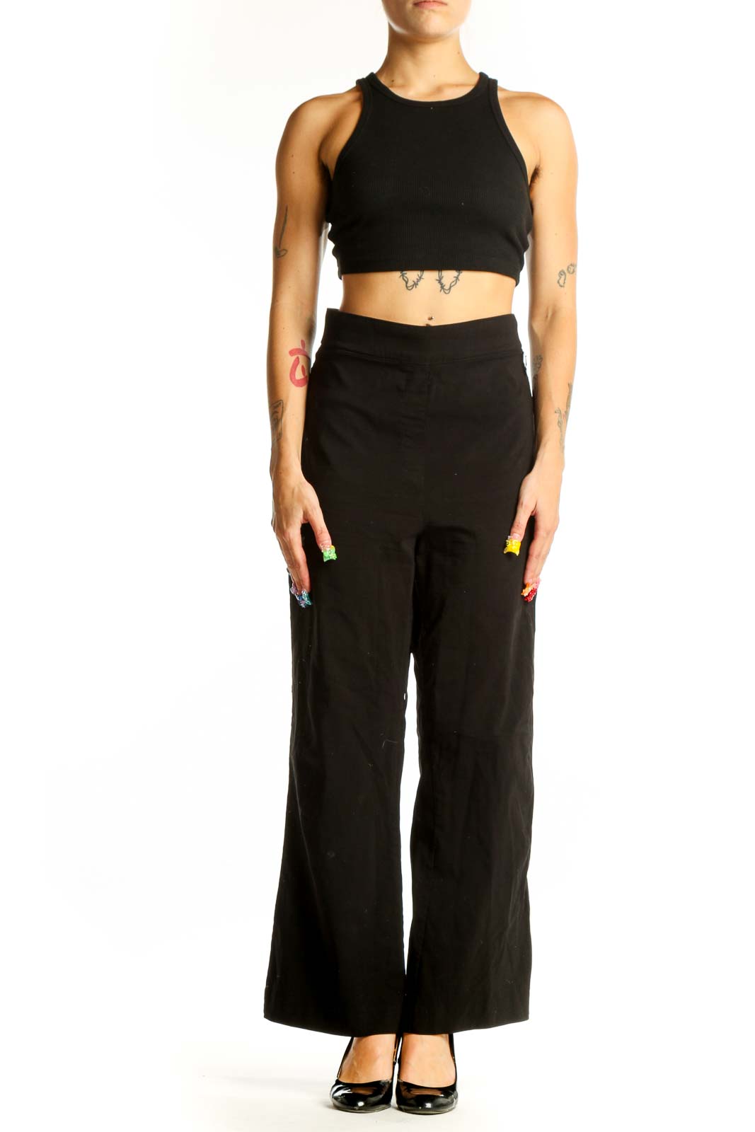 Front view of Calvin Klein black wide-leg trousers on model