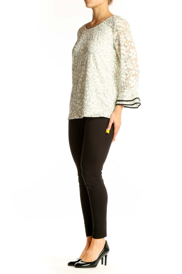 Front view of Karl Lagerfeld white lace top with bell sleeves