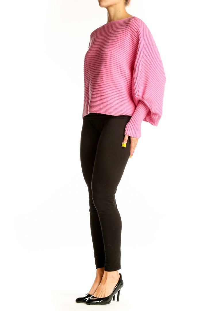 Front view of pink ribbed cotton oversized sweater with balloon sleeves