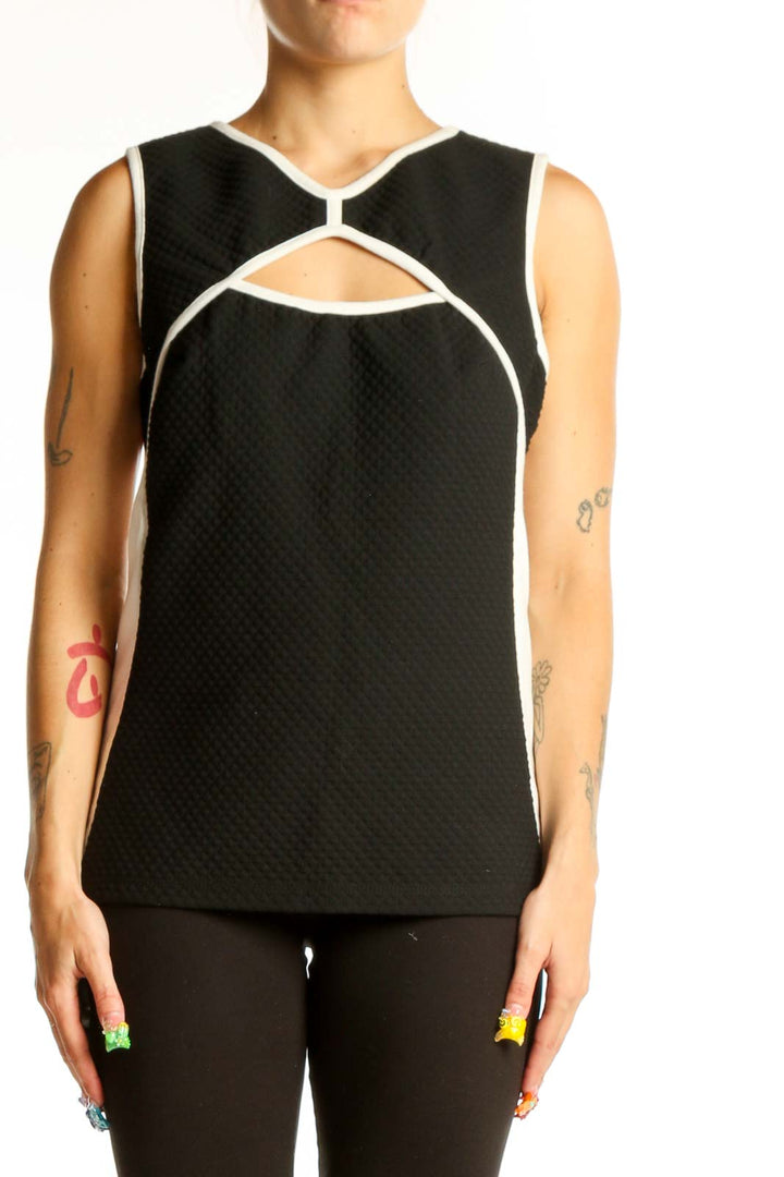 Front view of Bailey 44 black sleeveless top with cutout design and white trim