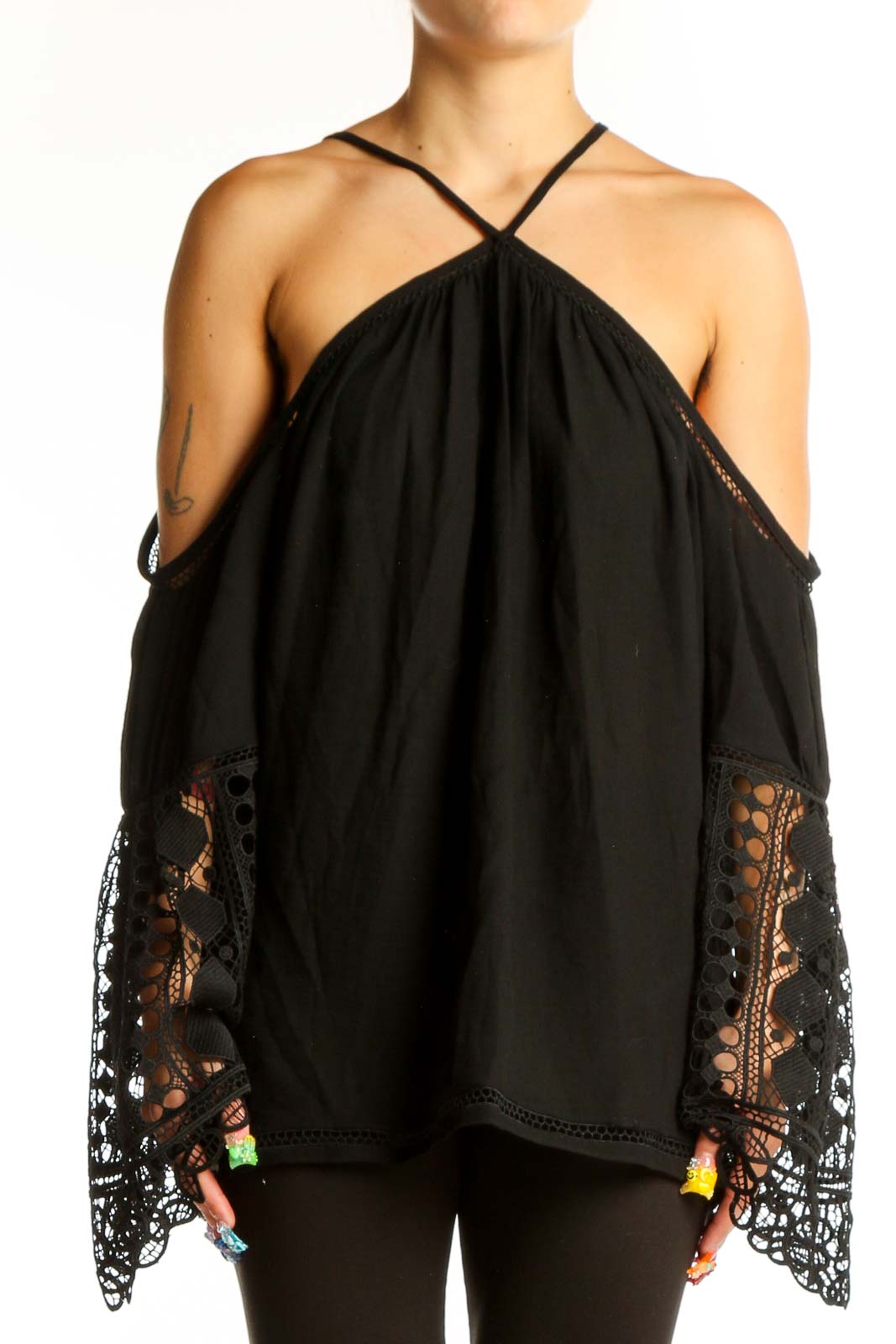 Front view of Ramy Brook black cold shoulder blouse with lace-trimmed bell sleeves