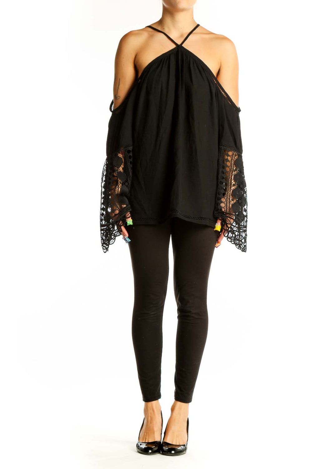 Front view of Ramy Brook black cold shoulder blouse with lace-trimmed bell sleeves