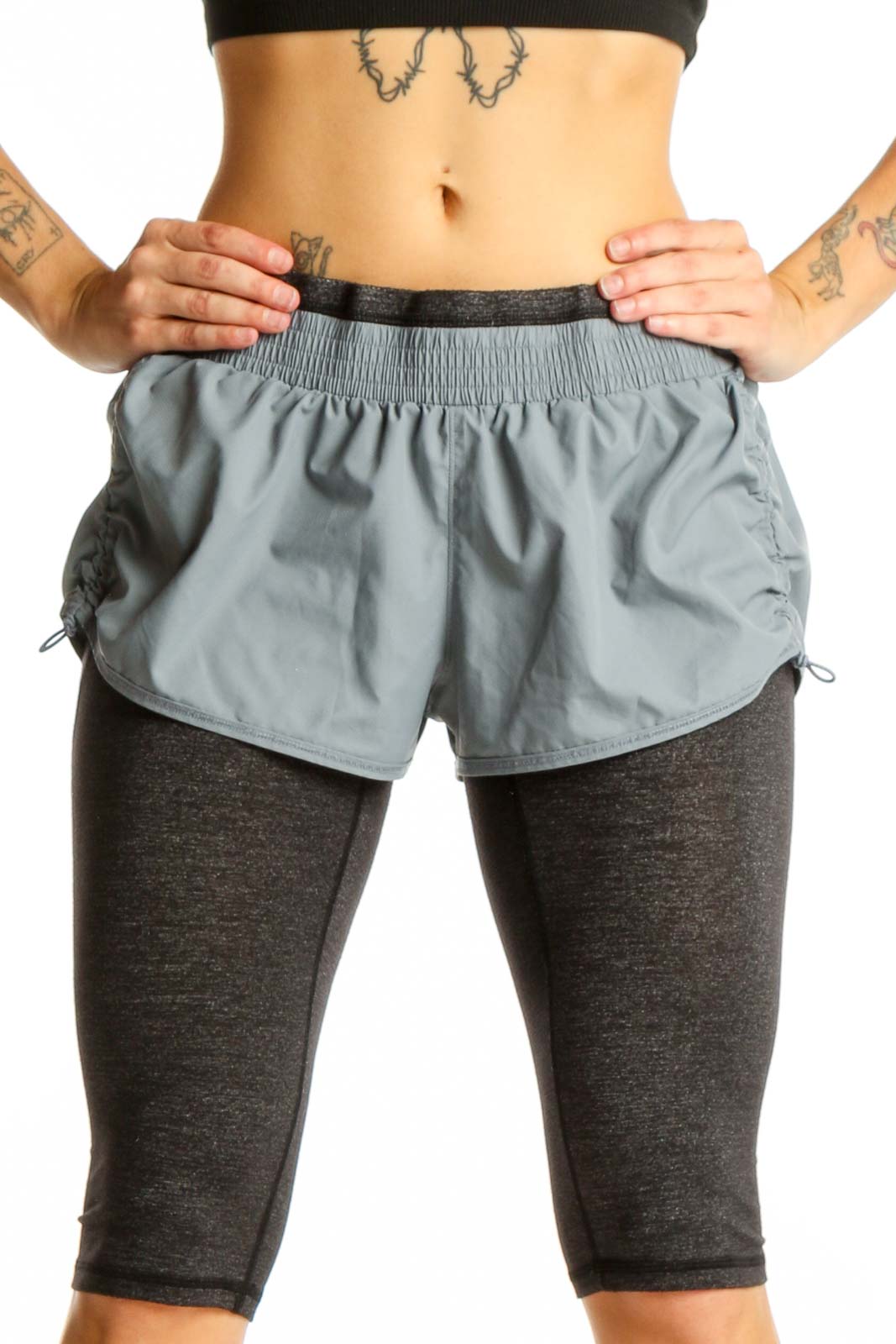 Front view of gray Athleta layered athletic shorts with fitted undershorts