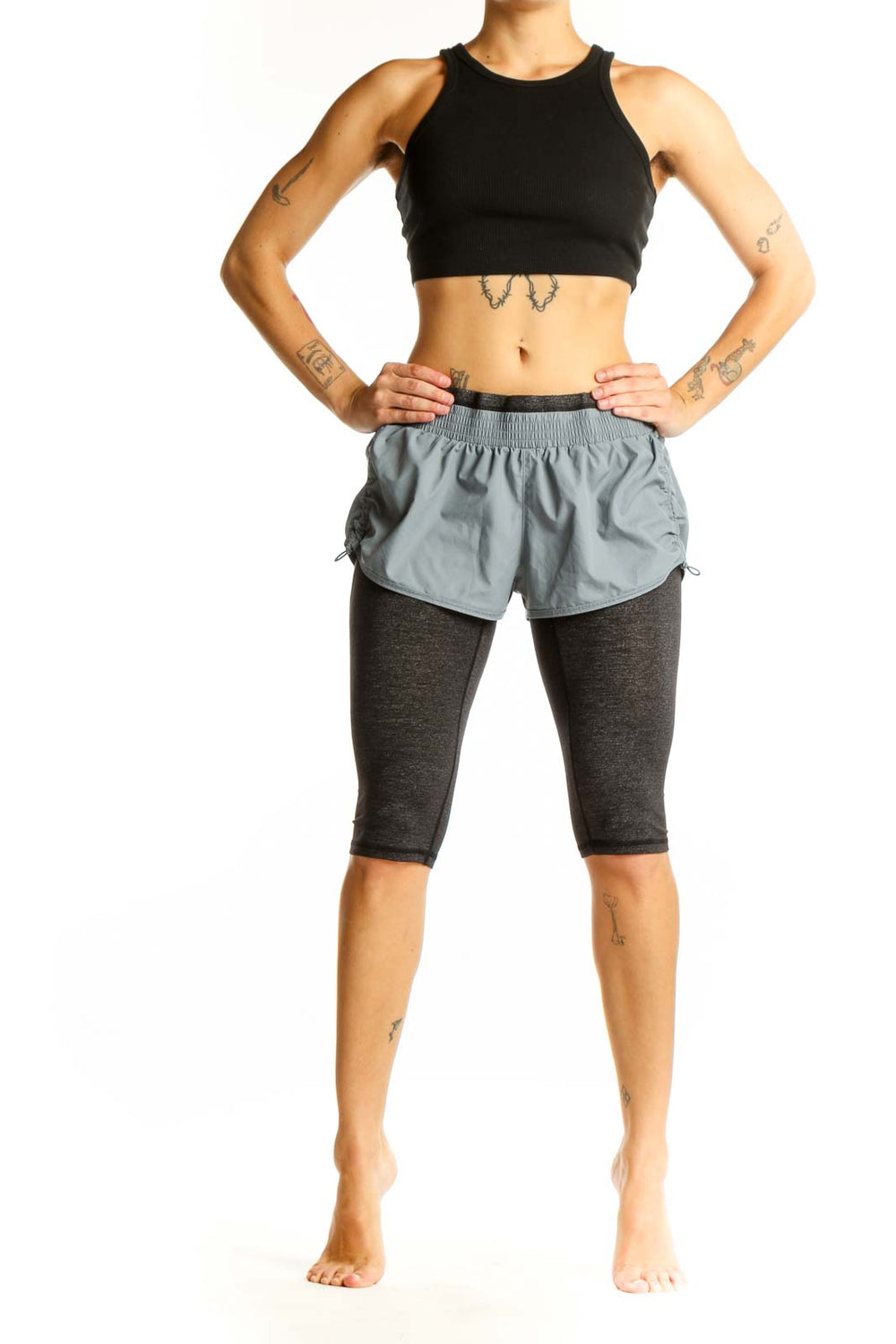 Front view of gray Athleta layered athletic shorts with fitted undershorts