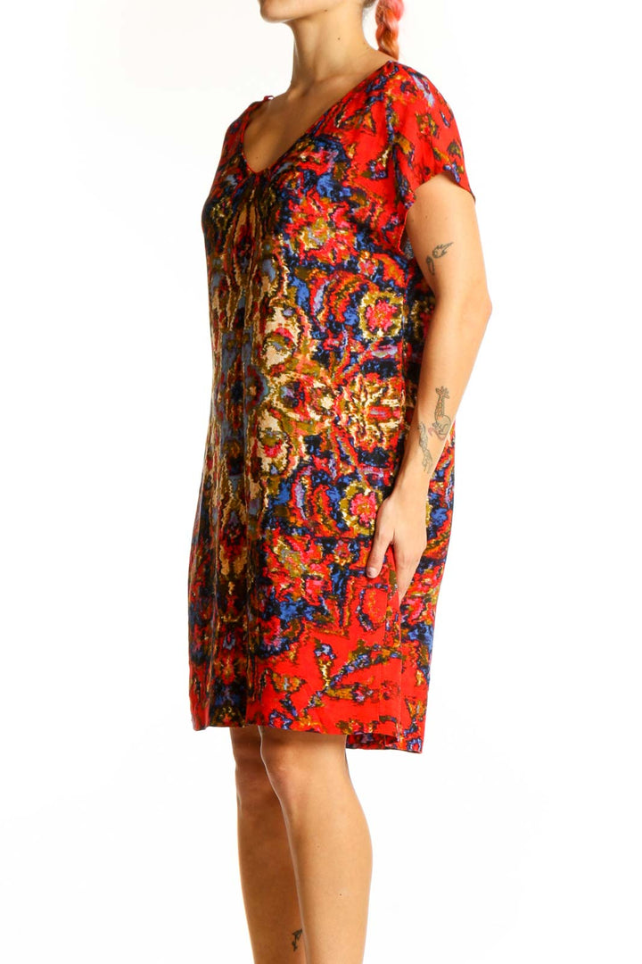 Front view of Maeve red floral shift dress with vibrant bohemian print