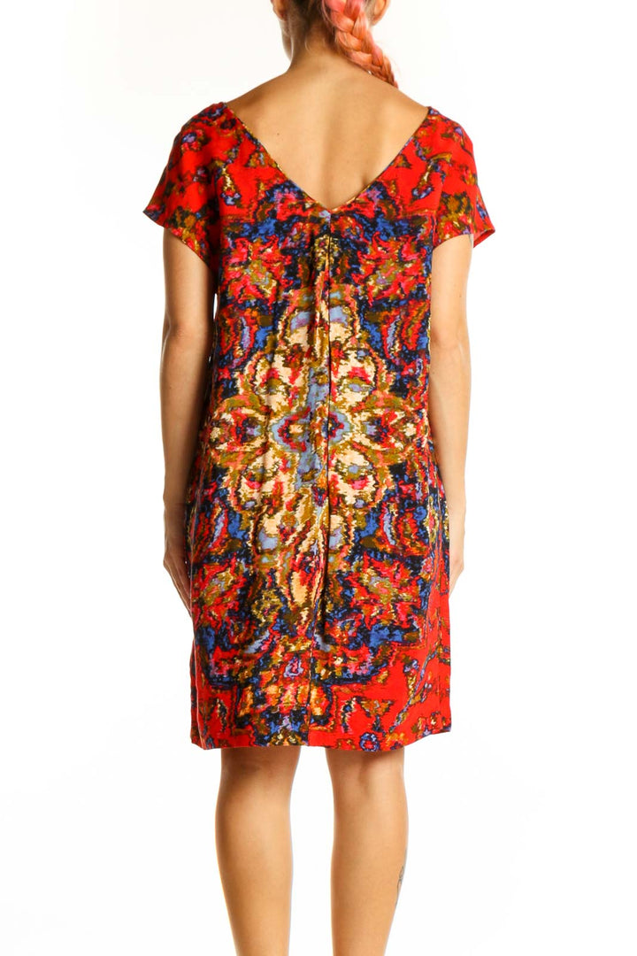 Side view of Maeve red floral shift dress showing loose-fitting silhouette