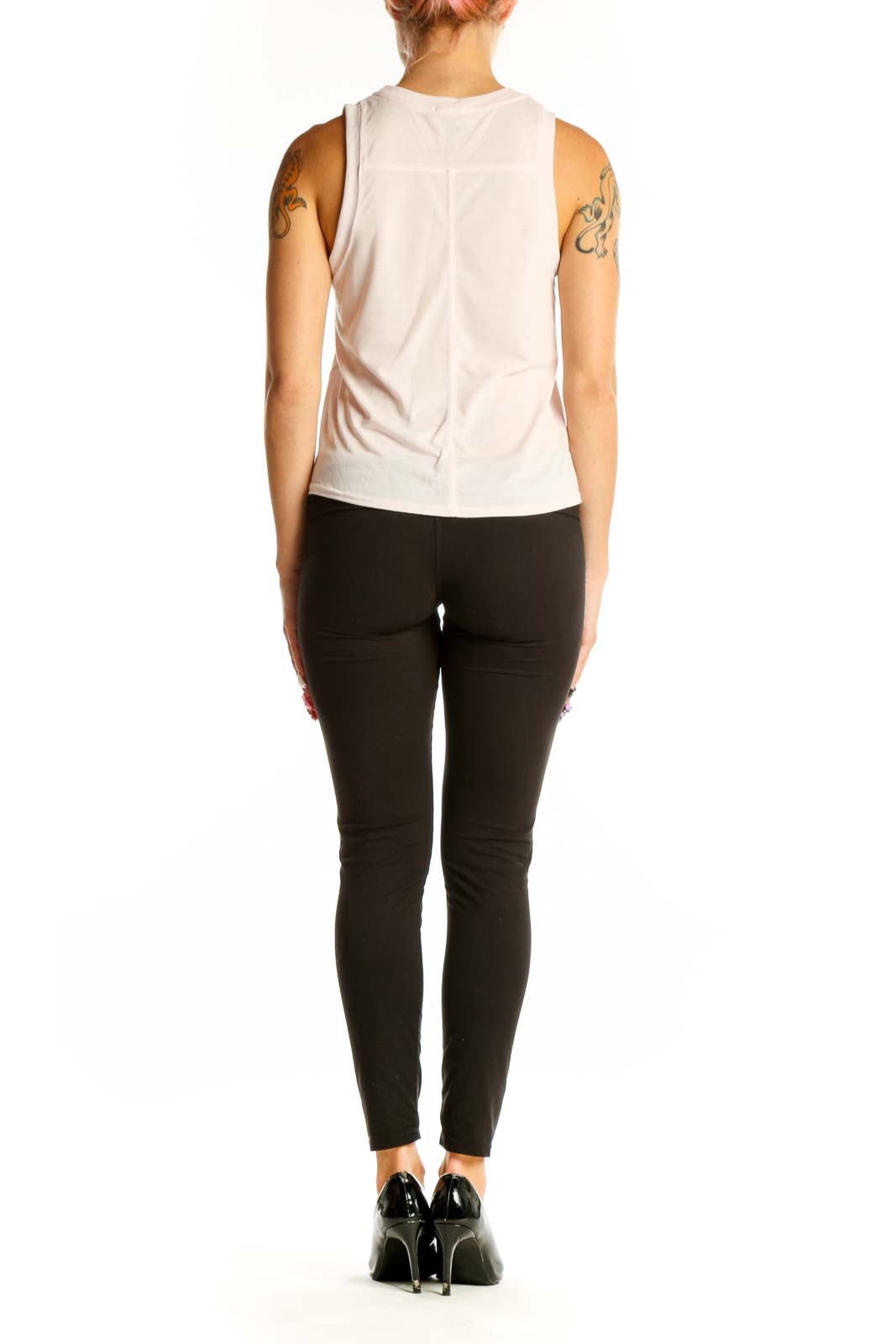 Side view of white Brooks sleeveless tank top on model