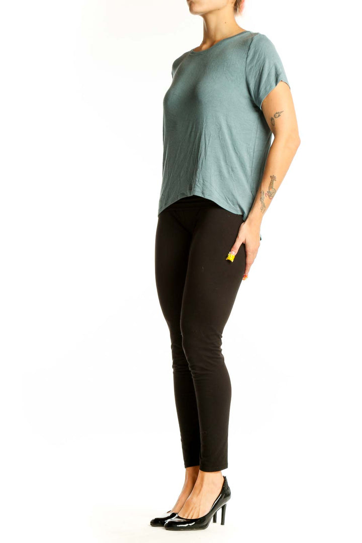 Front view of sage green Athleta athletic top with short sleeves