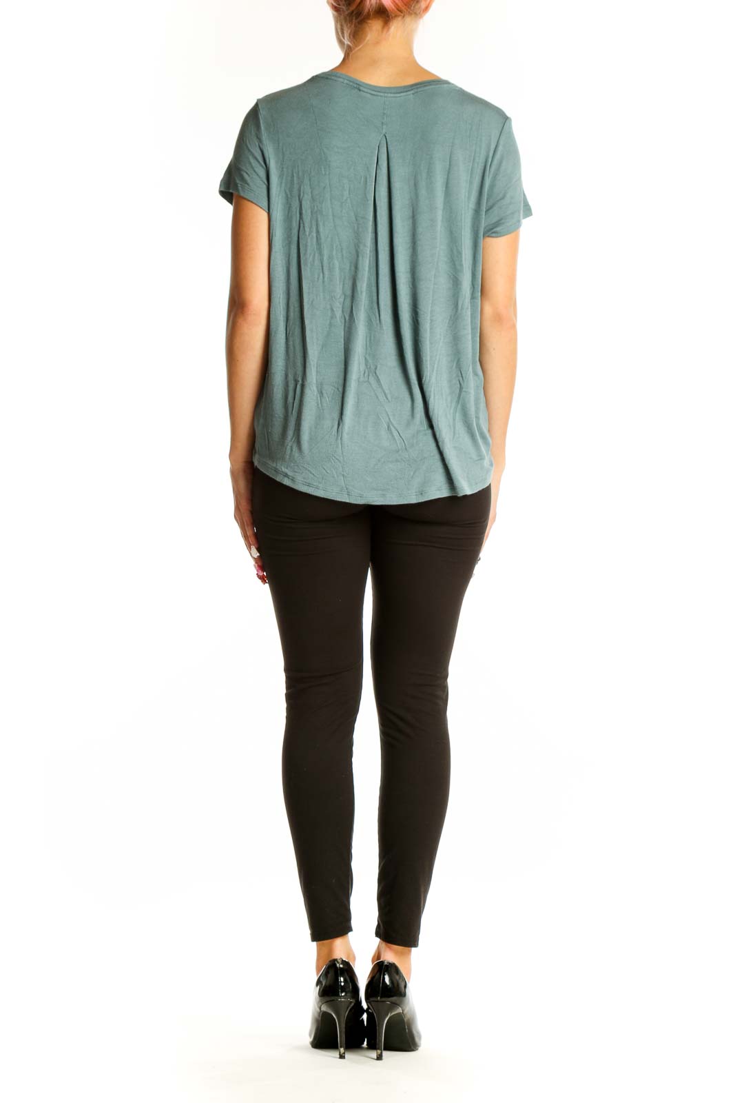 Side view of sage green Athleta athletic top showing relaxed fit