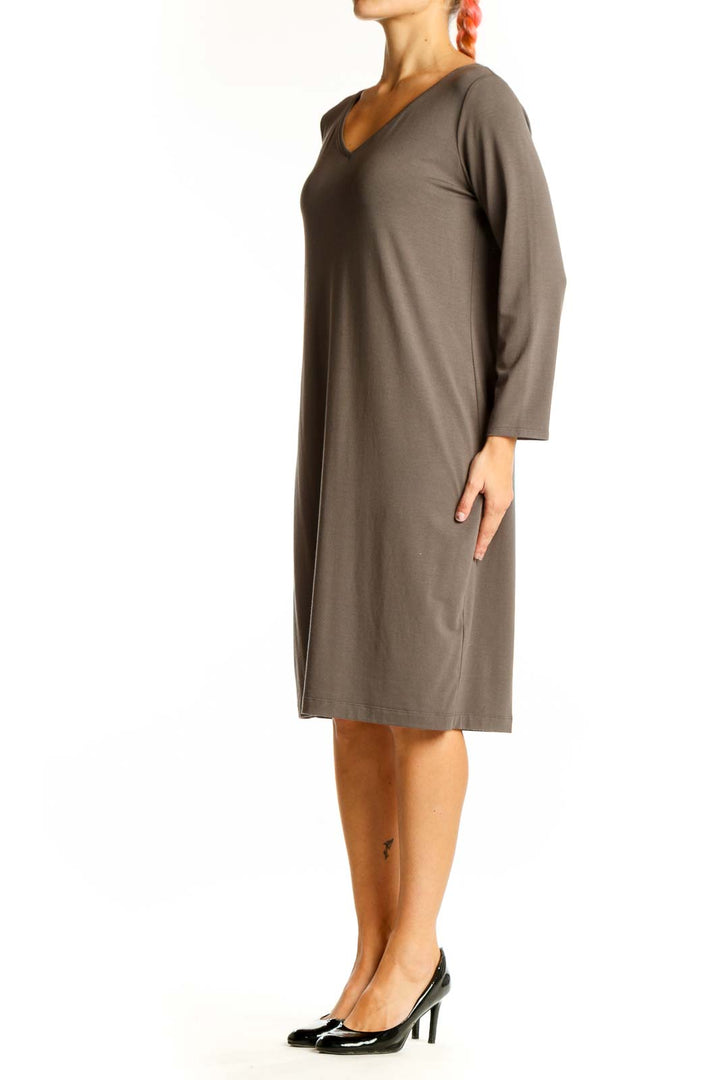 Front view of Eileen Fisher taupe V-neck long sleeve midi dress