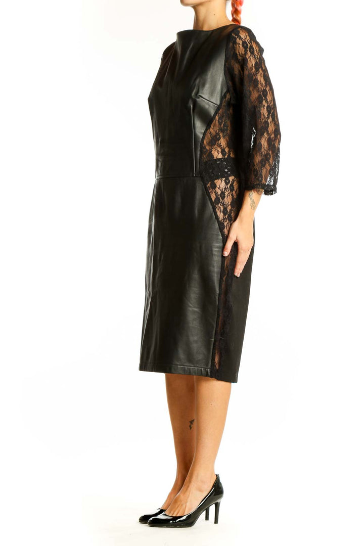 Front view of black leather midi dress with lace sleeves by Wheels & Dollbaby