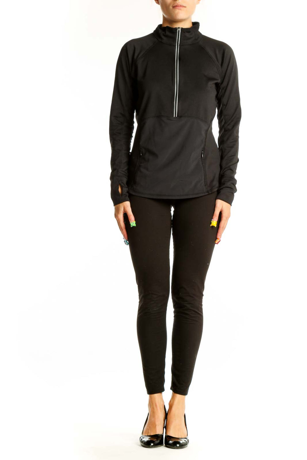 Front view of black Athleta half-zip performance top with stand-up collar