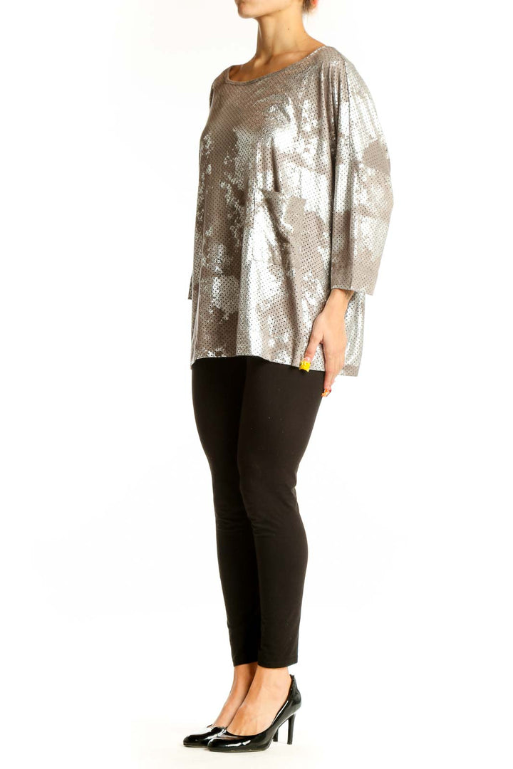Front view of Alembika silver metallic perforated oversized top with boat neckline