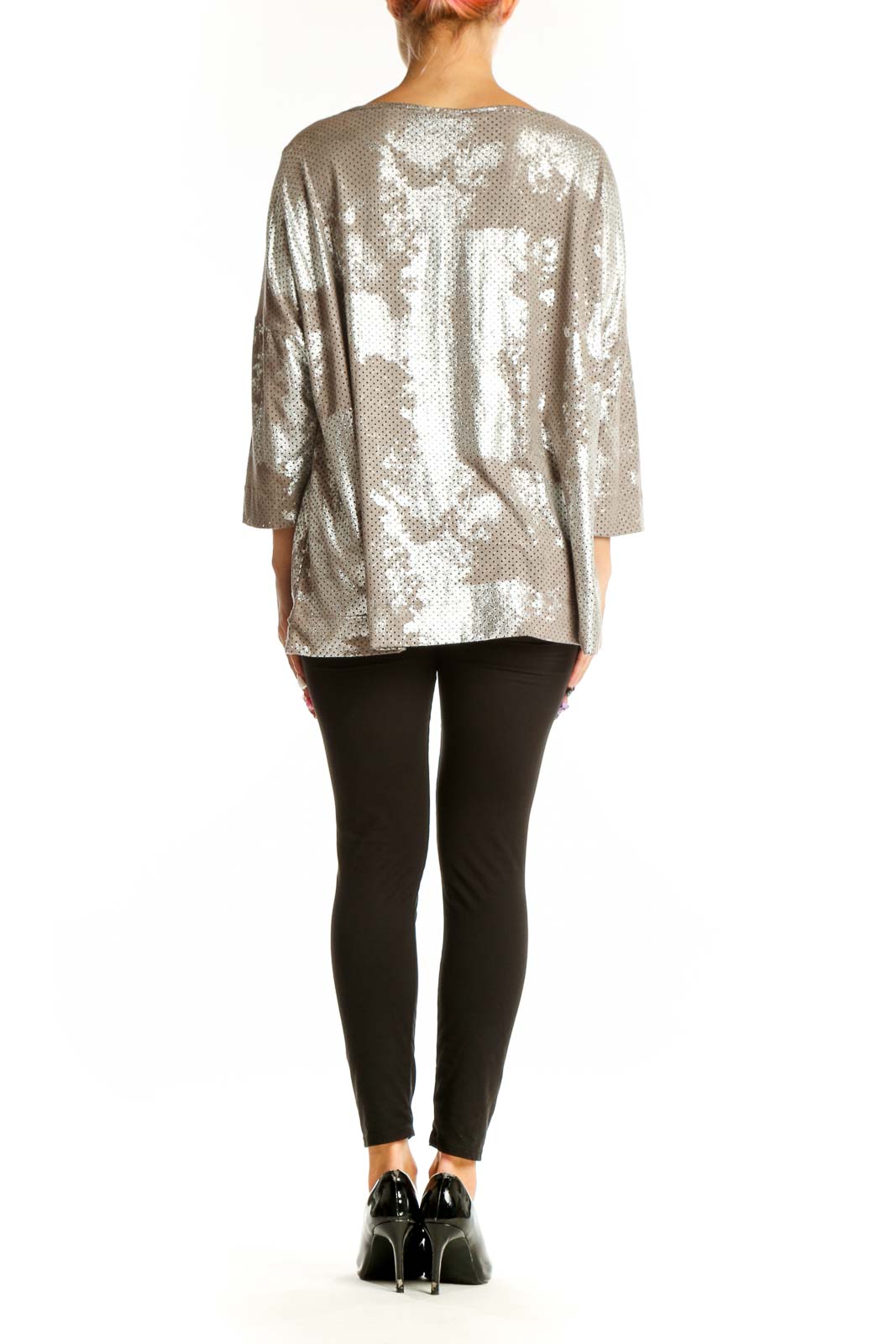 Side view of Alembika silver metallic perforated oversized top showing 3/4 length sleeves