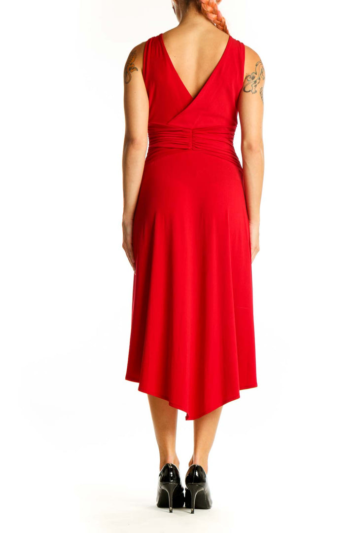 Back view of red London Times midi dress showing high-low hemline and sleeveless design