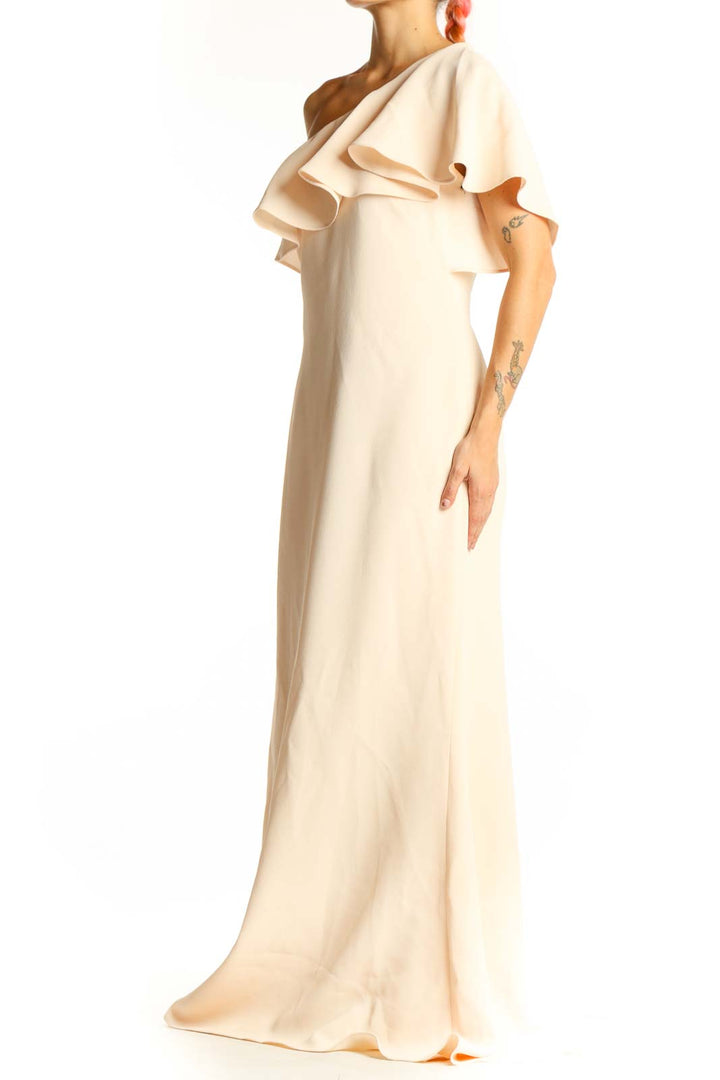 Front view of cream Vince Camuto one-shoulder maxi dress with ruffled overlay