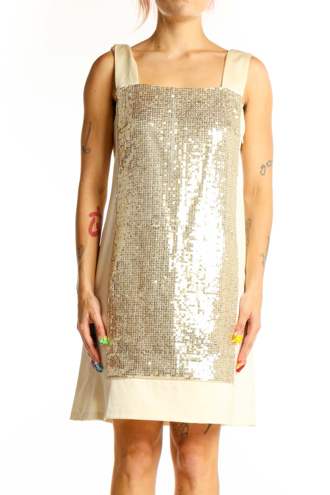 Front view of gold sequined Nanette Lepore cocktail dress with cream hem