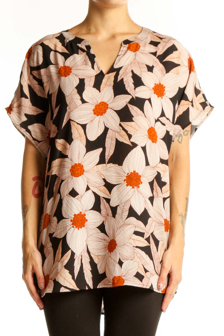 Front view of Cabi black blouse with pink and orange floral print